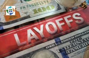 To Layoff or Not To Layoff — That Really is a Question $100 bill with "LAYOFFS" written across it in bold white letters.