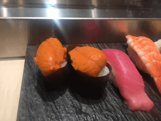 Sushi, including two pieces of Uni (sea urchin)