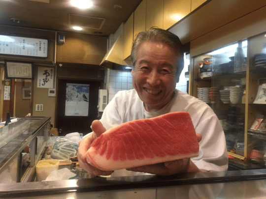 A proud sushi chef