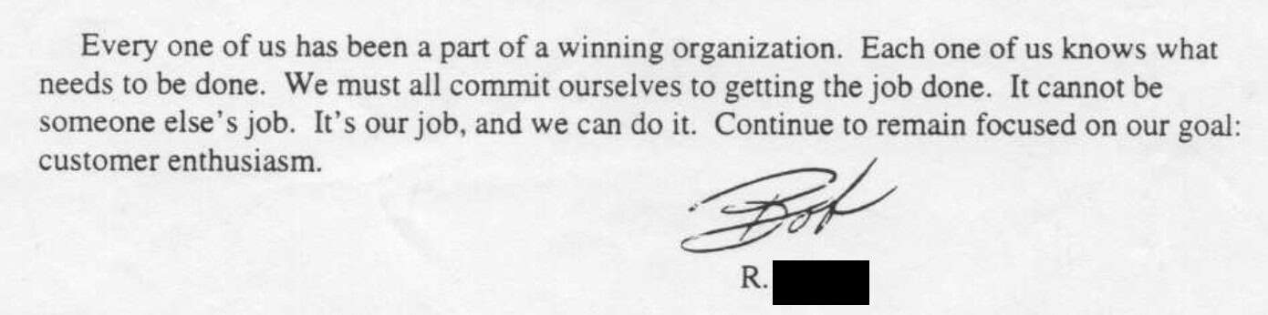 Handwritten signature above a text block emphasizing commitment to organizational goals and customer enthusiasm