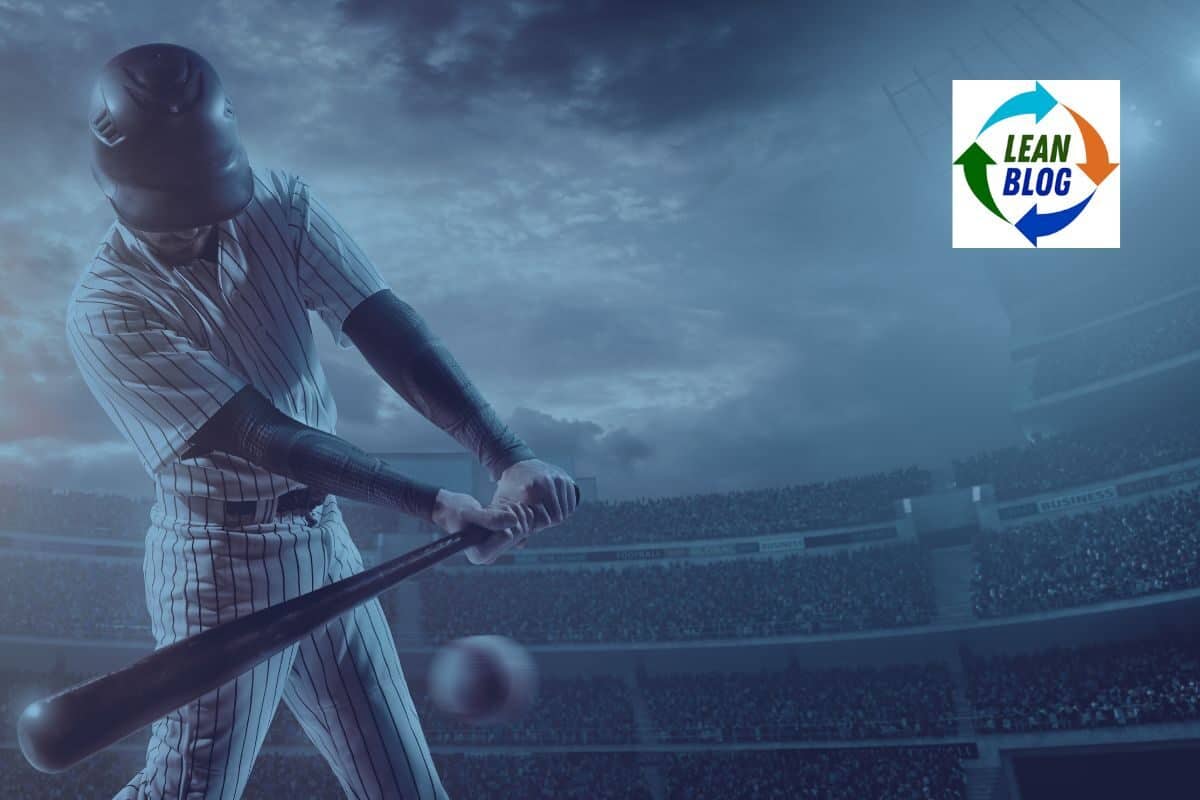 Swinging a baseball bat at dusk against a stadium background with a Lean Blog logo.