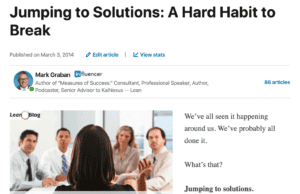 A Hard Habit to Break: Why Lean Problem Solving Fails When We Jump to Solutions An article by Mark Graban titled "Jumping to Solutions: A Hard Habit to Break," published on March 3, 2014, on LinkedIn. The article includes a header image of a woman leading a meeting with the caption, "Before I state the problem, are there any solutions?"