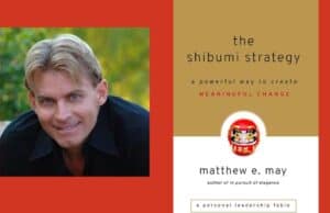 Podcast #103 – Matthew E. May, “The Shibumi Strategy” An image with a red background features two sections. On the left is a photo of a smiling man with blond hair and a black shirt. On the right is the cover of a book titled "the shibumi strategy: a powerful way to create MEANINGFUL CHANGE" by matthew e. may, author of "in pursuit of elegance." The cover also shows a Daruma doll.