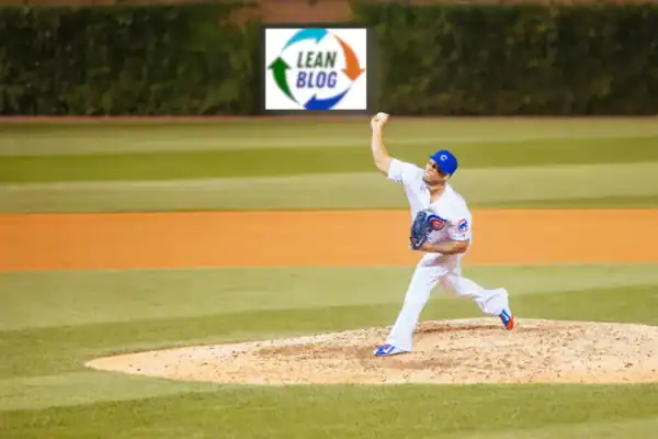 cubs pitcher throwing a ball with a lean blog logo on outfield wall