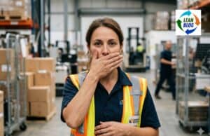 Problem-Seeing Eyes Are Everywhere. Problem-Speaking Mouths Are Rare. Worker covering their mouth in a workplace setting, representing the gap between seeing problems and speaking up about them