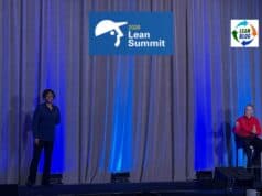 The Most Misunderstood Role in the Toyota Production System Michelle Thomas and Jamie Bonini of Toyota's Production System Support Center (TSSC) speaking on stage at the 2026 Lean Summit, with blue uplighting and a gray curtain backdrop.