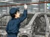 No, One Toyota Worker Can’t Stop the Whole Factory cartoon illustration of a team member pulling an andon cord