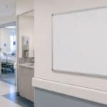 Bulletin board with headers Patient Safety, Quality, Patient Satisfaction, Financial Stewardship and no metrics posted.