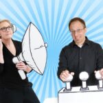 Joel Tosi and Elisabeth Hendrickson stand against a light blue radial background, one holding a megaphone and the other presenting on a podium