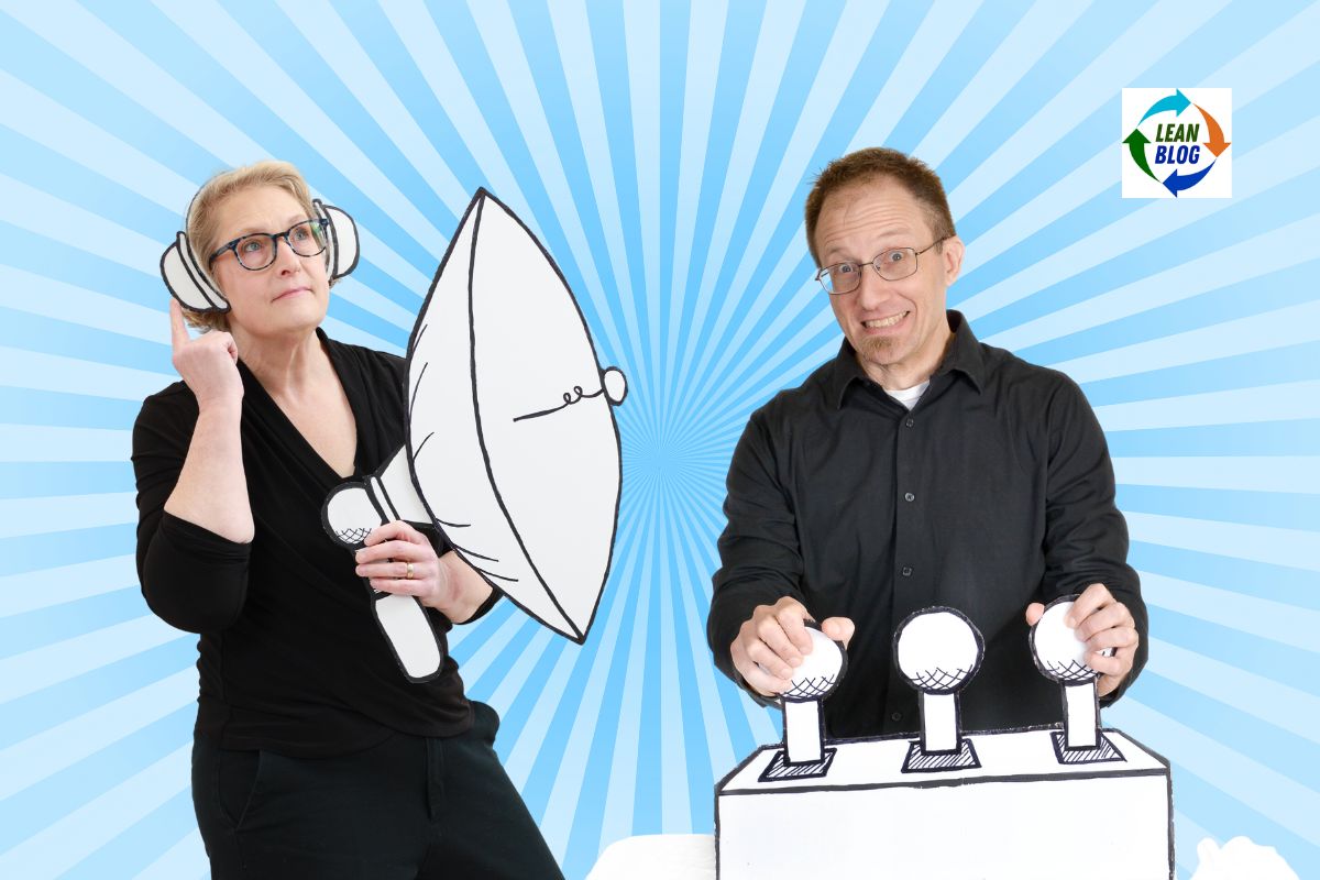 Joel Tosi and Elisabeth Hendrickson stand against a light blue radial background, one holding a megaphone and the other presenting on a podium
